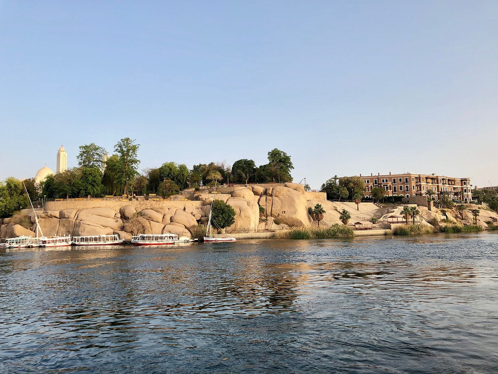 Feluccas moored beside a granite island on the Nile at Aswan