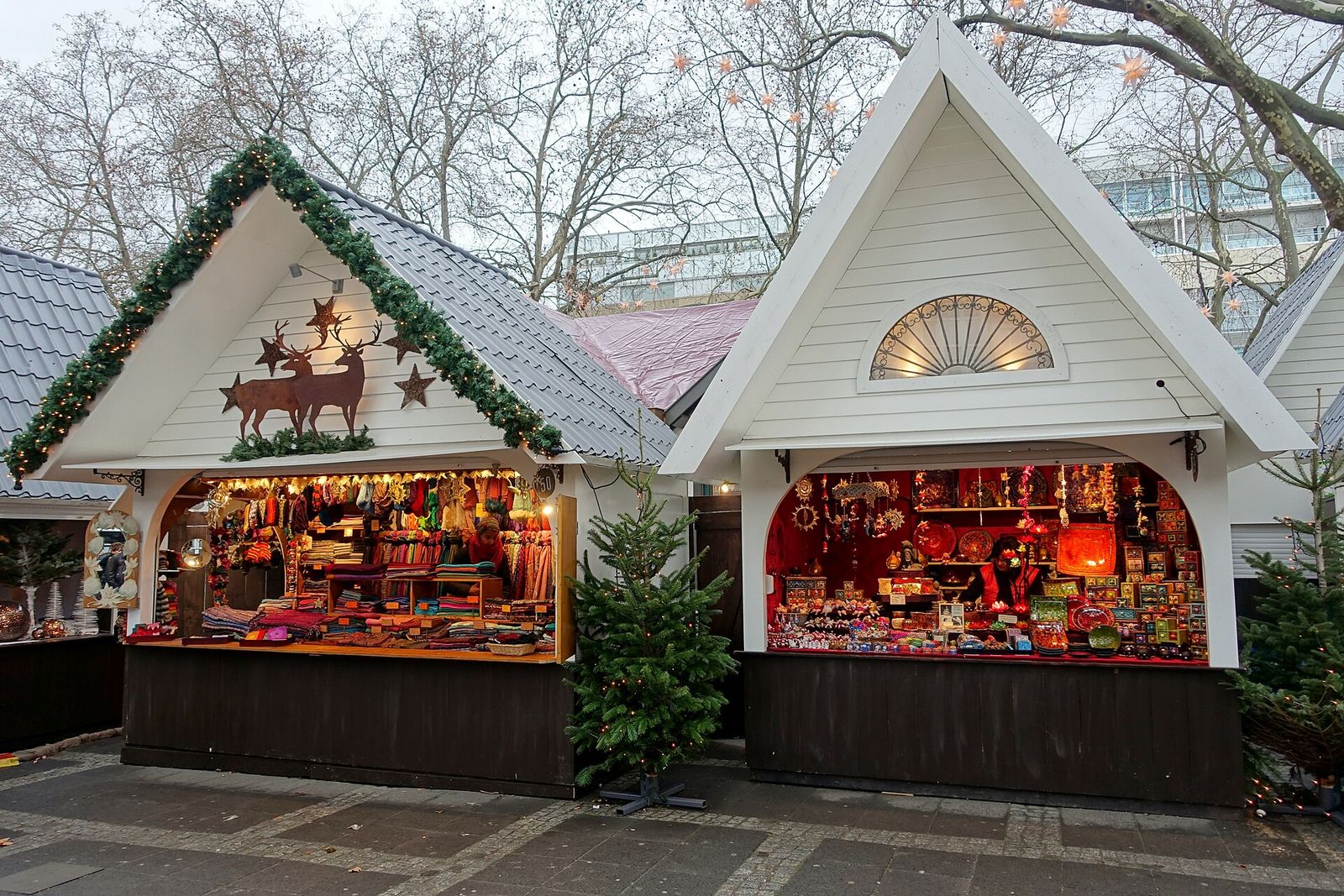 Wooden Christmas market chalets decorated with garlands